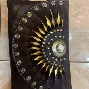 Leather clutch with stone details